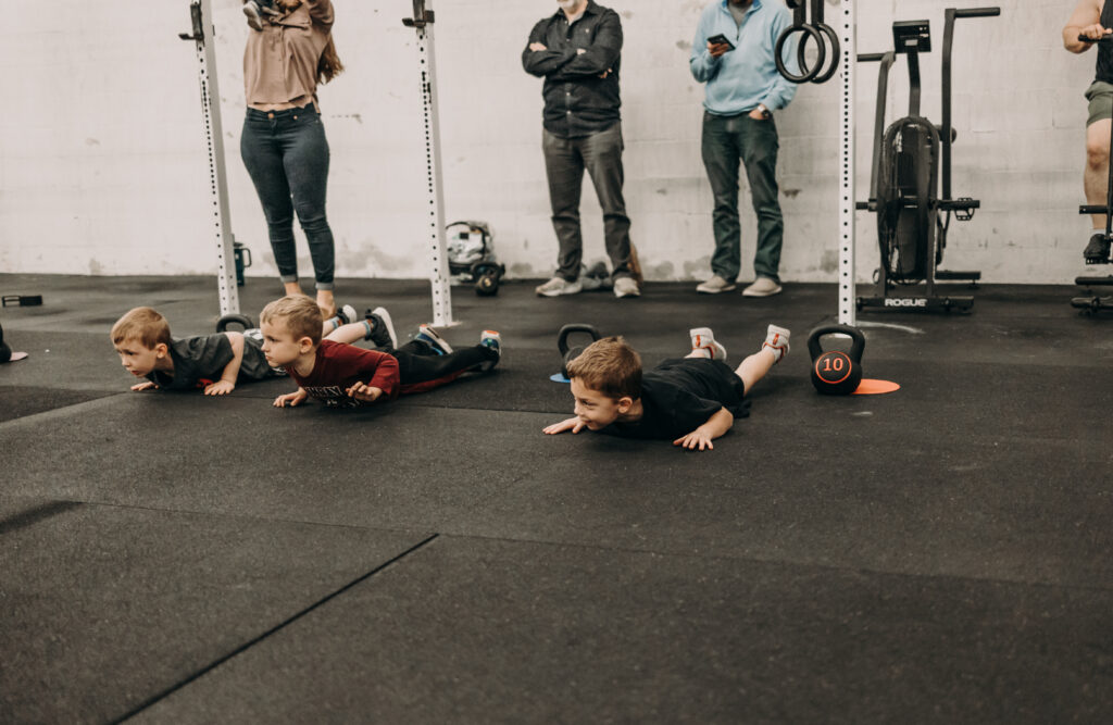 Kids exercising in an HB|Kids class